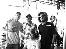 Kelly Slater with fellow pro surfers Rob Machado and Christiaan Bailey