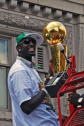 Garnett holds the Larry O'Brien Trophy at the championship parade of the 2008 NBA Champions Boston Celtics.