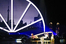 Minogue performing in Toronto during the For You, For Me tour (2009).
