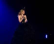 Minogue performing on her Aphrodite: Les Folies Tour, where she continued to tour in Japan when the 2011 Tōhoku earthquake and tsunami had struck (2011).