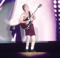 Young plays a solo during a performance of "Let There Be Rock"