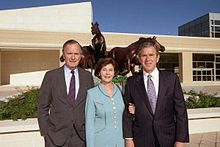 Laura Bush with husband Governor George W. (right) and father-in-law George H. W. (left) at the dedication of the George Bush Presidential Library, 1997