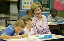 The First Lady shares a laugh with fifth graders in Des Moines, Iowa, 2005
