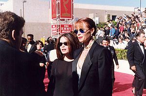 Lauren Holly (right) with Holly Marie Combs (left) at the 1993 Emmy Awards