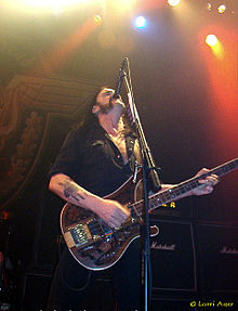 Lemmy playing bass and singing. The high microphone position has become a Lemmy trademark.