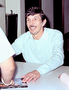Nimoy signing autographs at a Star Trek convention, c. 1980