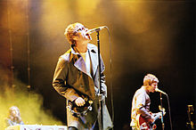 The Gallagher brothers performing at an Oasis concert in 2005