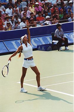 Kournikova preparing to serve