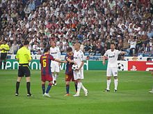 Messi playing against Real Madrid in a Champions League match