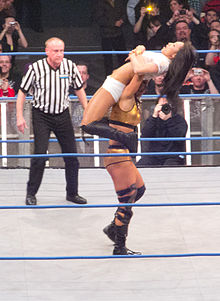 Tara setting up the Widow's Peak on Gail Kim at Wembley Arena, February 2012.