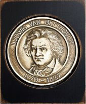 A modern medallion bearing the face of Beethoven