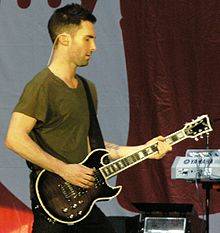 Levine playing the First Act 222 Guitar, which he helped design