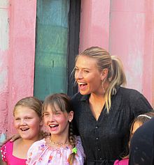 Sharapova with children in Gomel, an area affected by the Chernobyl nuclear disaster in 1986.