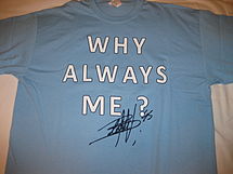 A signed Mario Balotelli replica shirt with his famous slogan: "Why always me?".