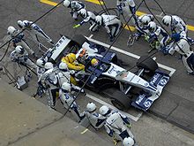 Webber during pit stop at 2005 San Marino Grand Prix.