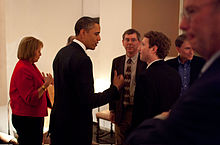 Zuckerberg listening to President Barack H. Obama before a private meeting where Obama dined with technology business leaders in Woodside, California, February 17, 2011. (Also pictured, from left: Carol Bartz of Yahoo!, Art Levinson of Genentech, Steve Westly of The Westly Group, and Eric Schmidt of Google.)