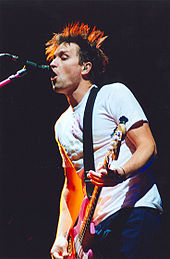 Hoppus performing with Blink-182 on the band's 2004 tour.