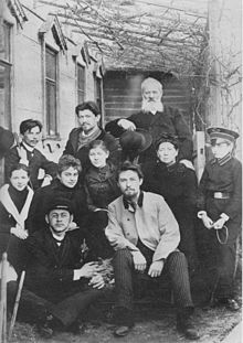 Chekhov family and friends in 1890. (Top row, left to right) Ivan, Alexander, Father; (second row) unknown friend, Lika Mizinova, Masha, Mother, Seryozha Kiselev; (bottom row) Misha, Anton