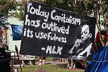 Protestors at the 2012 Republican National Convention display Dr. King's words and image on a banner.