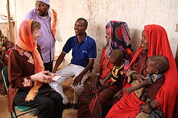 Robinson meeting families in Somalia, 2011.