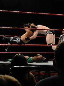 Hardy performing a Twist of Fate on Sheamus.