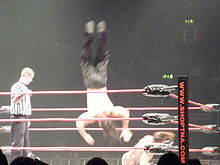 Hardy performing a moonsault on Rob Van Dam.
