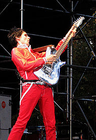 Bellamy performing live at the Virgin Festival in Toronto using the Manson guitar; Chrome Bomber Manson.