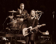 During his tenure with the E Street Band, Weinberg's gaze remains locked on Springsteen throughout each show.