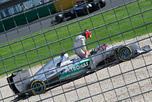 Schumacher climbs out of his car after spinning off during the final practice session at the Australian Grand Prix. He retired from the race with gearbox problems.