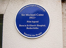 A blue plaque erected in 2003 marks Caine's birthplace at St Olave's Hospital