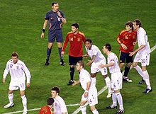 Carrick (bottom) in the 2–0 defeat to Spain on 11 February 2009