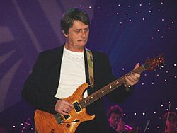 Mike Oldfield playing a PRS Custom 24 guitar at the Night of the Proms in December 2006.