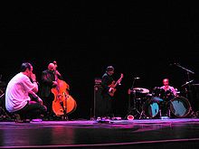 Patton (left) with Gavin Bryars (bass), Bill Laswell (bass guitar) and Milford Graves (drums) in a 2006 tribute to guitarist Derek Bailey.