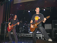 Kennedy (left) performing with Alter Bridge in 2008.