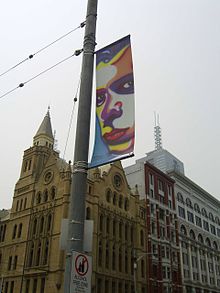 Banner in Melbourne of Howard Arkley's 1999 portrait of Nick Cave, held at the National Portrait Gallery