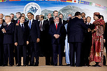 Sarkozy (at left) attending the G-8 Summit in 2009