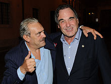 Oliver Stone with Rino Barillari in "Piazza dé Ricci" exit of the restaurant "Pierluigi" in Rome - September 25, 2012