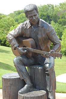 "Otis Redding Sittin on the Dock of the Bay", statue in Gateway Park by Bradley Cooley and Bradley Cooley, Jr of Bronze By Cooley, 2003