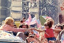 Pat Nixon reaches out from her limousine to a young girl during an October 1972 campaign stop in Atlanta.
