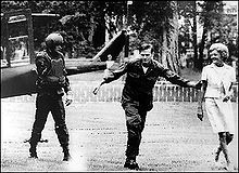 Escorted by armed guards, Pat (far right) arrives via helicopter on the ground in South Vietnam. It was the first time a first lady had entered a combat zone.