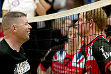Prince Harry talking to an opponent during a volleyball competition between American and British injured soldiers, 13 May 2013