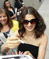 Rachel Weisz signing an autograph during the press conference for The Brothers Bloom in 2008
