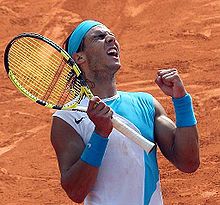 Nike sleeveless shirt with matching headband & wrist bands and Babolat AeroPro Drive GT at Roland Garros 2007