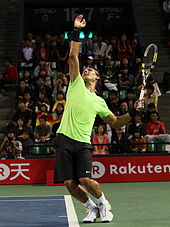 Nadal serving in Tokyo