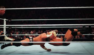 Orton performing the RKO (Jumping cutter) on Dolph Ziggler.