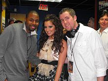 Tisdale posing for a fan picture at the 2008 "Jingle Ball" sponsored by Philadelphia's WIOQ