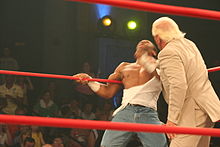 Flair delivering knife edge chops to Jay Lethal.