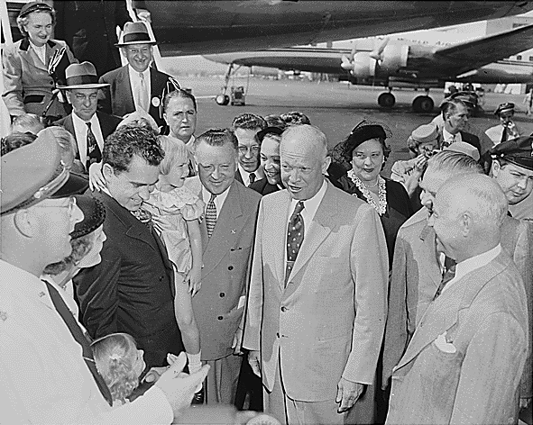 Richard and Pat Nixon introduce General Dwight D. Eisenhower—Richard Nixon's running mate—to their daughters Tricia (standing) and Julie (carried by her father), Washington National Airport, September 10, 1952.