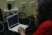 Richard Stallman using his Lemote machine at Indian Institute of Technology Madras, Chennai before his lecture on 'Free Software, Freedom and Education' organized by Free Software Foundation, Tamil Nadu (FSFTN).