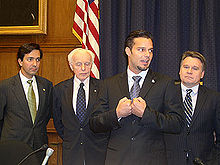 Ricky Martin (mid right) in Congress, with Luis Fortuño (far left), Tom Lantos (mid left) and Chris Smith (far right).